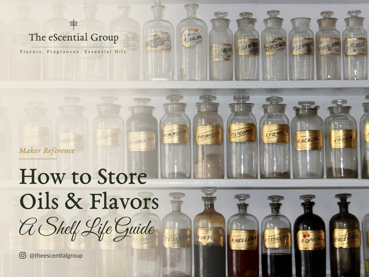 Clear glass apothecary jars with gold labels on white shelves