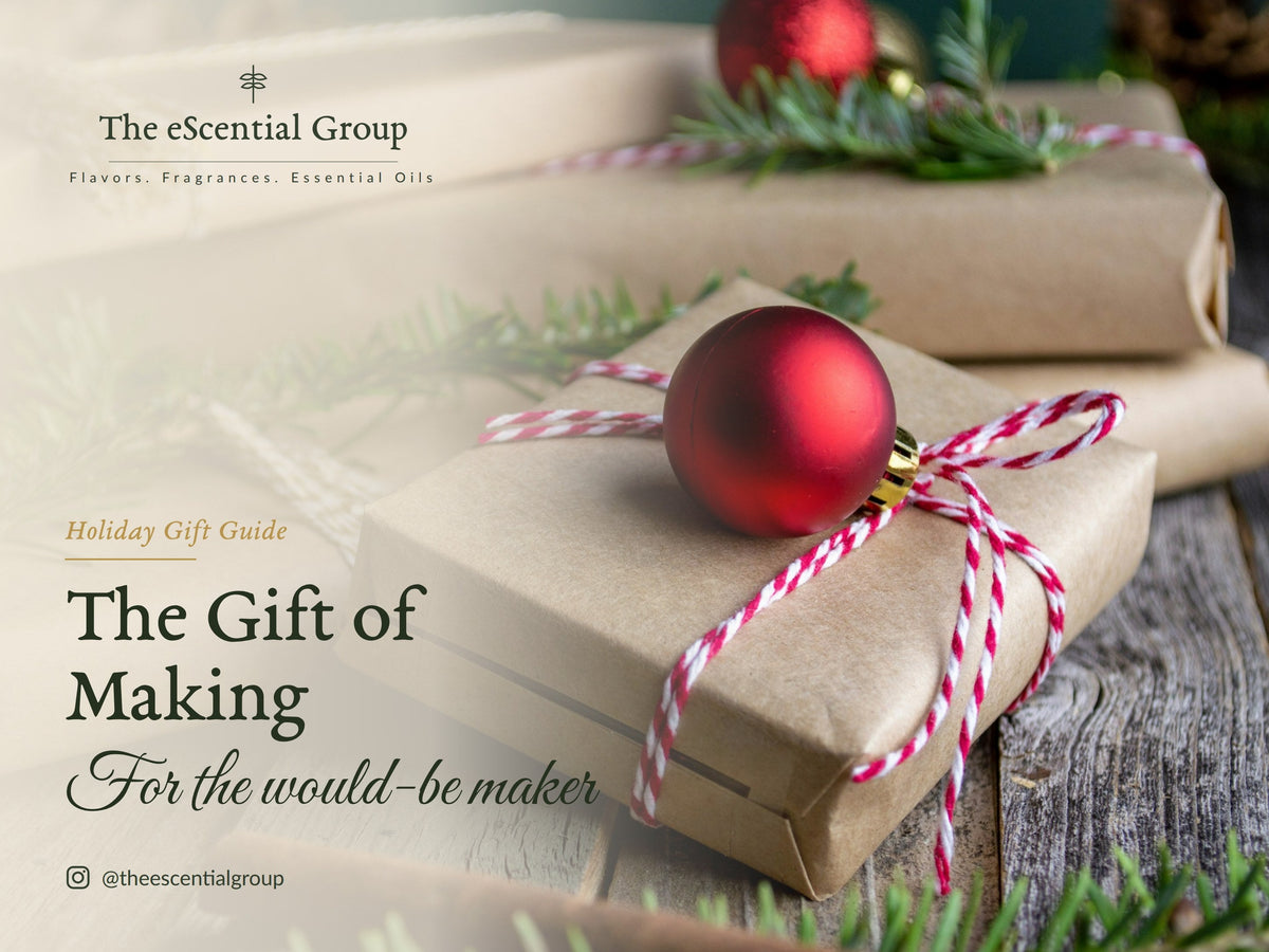 Kraft paper gift box tied with red and white twine and a red ornament